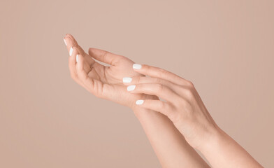 Fototapeta premium Young woman showing hands with silky skin and perfect manicure on pink background, closeup. Panorama