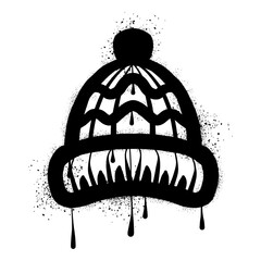 Drawing knit hat graffiti with black spray paint