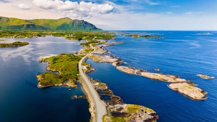 An aerial view of the Atlantic Road in Norway, showcases the winding road as it weaves through a chain of islands and inlets at summer © Fokke Baarssen