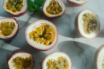 sliced passion fruit on white marble  background.