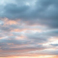 Fototapeta premium Pastel sunset clouds, soft hues, peaceful sky.