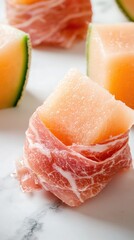 Fototapeta premium Delicious prosciutto-wrapped melon slices gourmet kitchen food bright atmosphere close-up view culinary delight