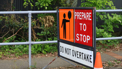 Lollipop sign, prepare to stop, do not overtake, road work sign 