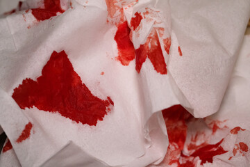 Textured Backgrounds Blood-stained tissue. Red tissue due to wiping blood from a wound. Medical...