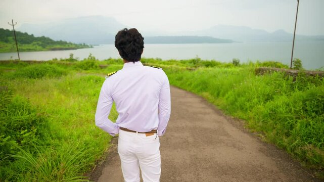 Pilot Walk towards Girlfriend In Scenic Outdoor