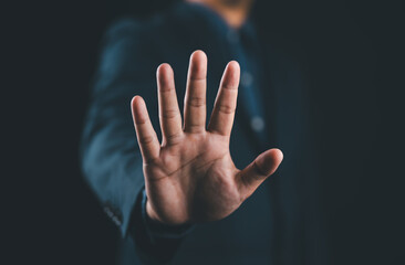 Businessman hand showing palm gestures stop, concept violence, warning, refuse, defense, caution. The hand sign of men a stop.