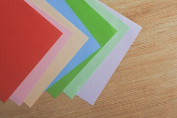 colorful paper on a wooden table