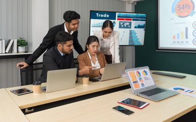 Group of business people in suit analyze stock information in the meeting room. Business executives...