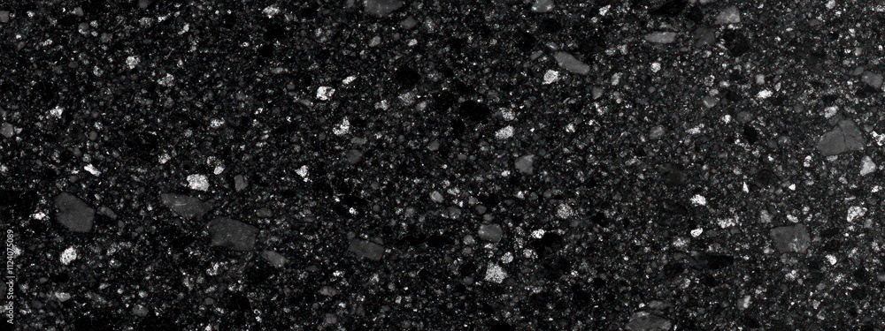 Poster A textured black surface with scattered small stones or particles, creating a uniform appearance.