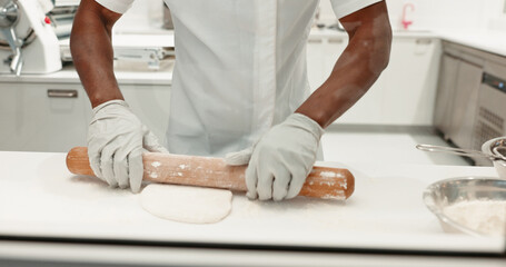 Rolling pin, bakery and dough with hands in kitchen for coffee shop, food industry and meal prep....