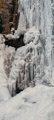 beautiful frozen waterfall in the mountains