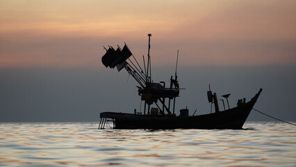 Silhouette of a fishing boat at sunset- pataya thailand