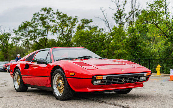 Chicago, Illinois - September 29, 2024: 1980 Ferrari 308 GTSi. Red 1980 Ferrari 308 GTSi driving on the road.