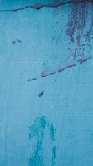 A distressed, peeling wall, showcasing a vintage aesthetic, ideal for textured backgrounds. A...