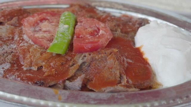 iskender Doner Kebab with butter, tomato sauce and yoghurt, Turkish Traditional meal