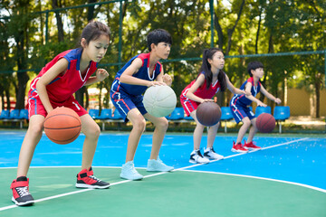 Chinese Kids Warming Up During Basketball Training Class