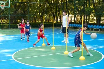Chinese Kids Warming Up During Basketball Training Class © Blue Jean Images