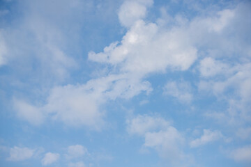 Sky background with clouds. White clouds against a blue sky.