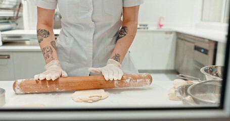 Rolling pin, bakery and dough with hands of person in kitchen for coffee shop, food industry and meal prep. Cooking, chef and nutritionist with baker closeup in restaurant for pastry, cafe and flour
