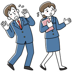困っているスーツ姿の男女