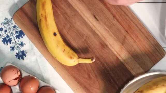 Making one of the coziest desserts, banana bread pudding from scratch.  Bananas, eggs, milk and sugar make a delicious dessert.