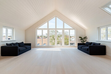 Bright and spacious living room with large windows and minimalist decor in modern design