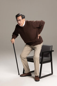 Senior Chinese man having a backache