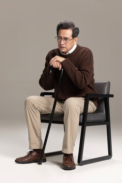 Senior Chinese man searching for instructions for pills