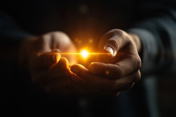 Person holding a glowing orb with both hands in a dark setting to symbolize hope and energy