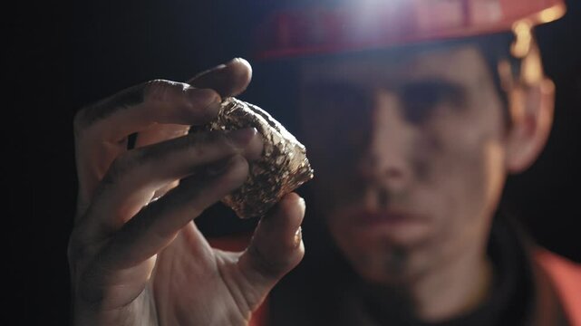 Gold Prospector Examining a Nugget Found During His Hunt