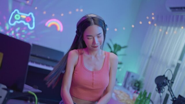 Asian young woman DJ mixing and scratching on music mixer controller. 