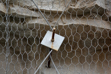 Rock sliding prevention. Mesh net and mutiple strong nails help to catch loosened rocks and...