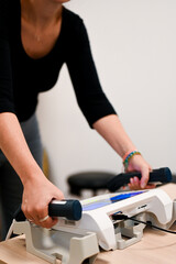 Nutritionist holding measurement device handles in clinic