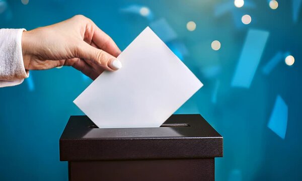 Election day, people vote by throwing a ballot into a transparent box. Hand with a clean postal envelope against the background of the box, close-up. Democratic elections, referendum, voting.