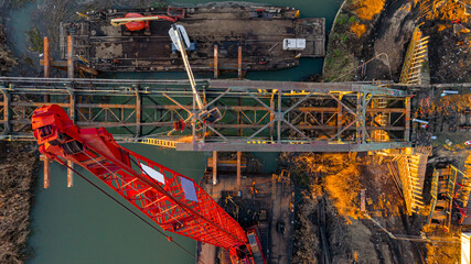Aerial view on worker as they cutting waste metal of bridge by mixing oxygen and acetylene gas,...