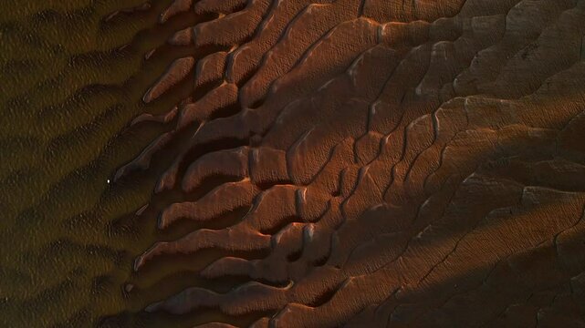 The wavy sandy soil caused by the water flowing and then the Mekong River dried up at sunset.Nakhon Phanom Province