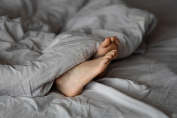 feet under the blanket