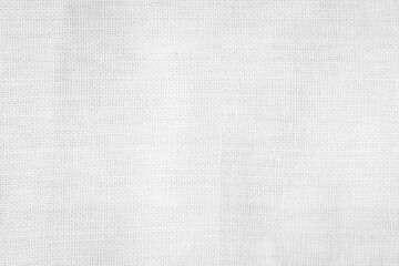 White textures of canvas, fabric, and paper showcasing a seamless design in natural shades of gray, ideal for a vintage backdrop or textile pattern.