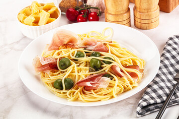 Pasta spaghetti with olives and jamon