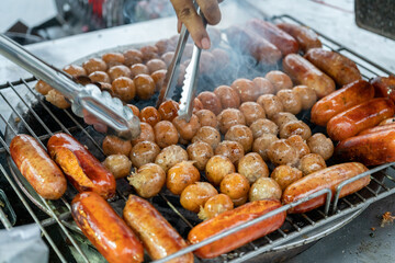 Northeast Thai Grilled Sausages (Pork and Rice Sausage). Street Food of Thailand.