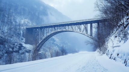 Majestic Winter Bridge in Snowy Mountain Valley: A Serene Landscape