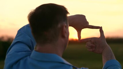 man stands serene field, capturing perfect sunset shot, capturing the perfect sunset, photographer perspective, golden hour magic, framing moment, chasing light, through lens, visual storytelling tips