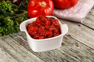 Diced ripe tomato with sauce