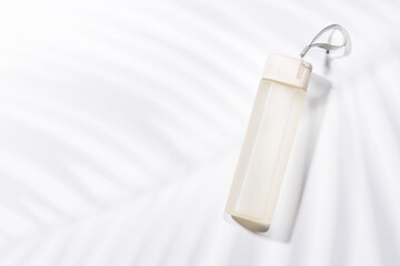 A sleek water bottle placed on a bright white background