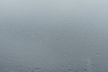 Raindrops on window glass. Rainy weather.