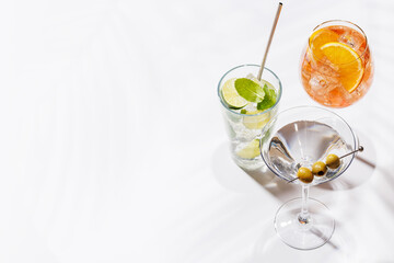 A vibrant display of cocktails, including Aperol Spritz, Mojito, and Martini