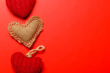 Valentine's Day heart-shaped decorations set against a vibrant red background