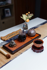 Elegant Traditional Tea Set Display, enhanced with a Floral Arrangement for aesthetics