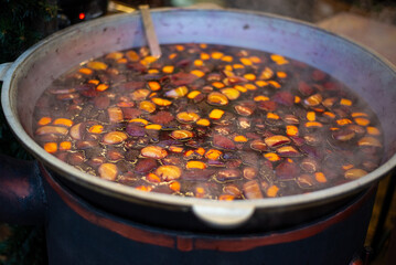 Large Cauldron with Tasty Mulled Wine at a Winter Fair. Christmas market concept