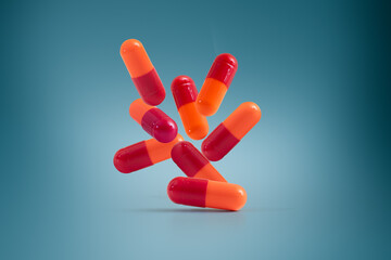 Red and orange capsules on a blue background
